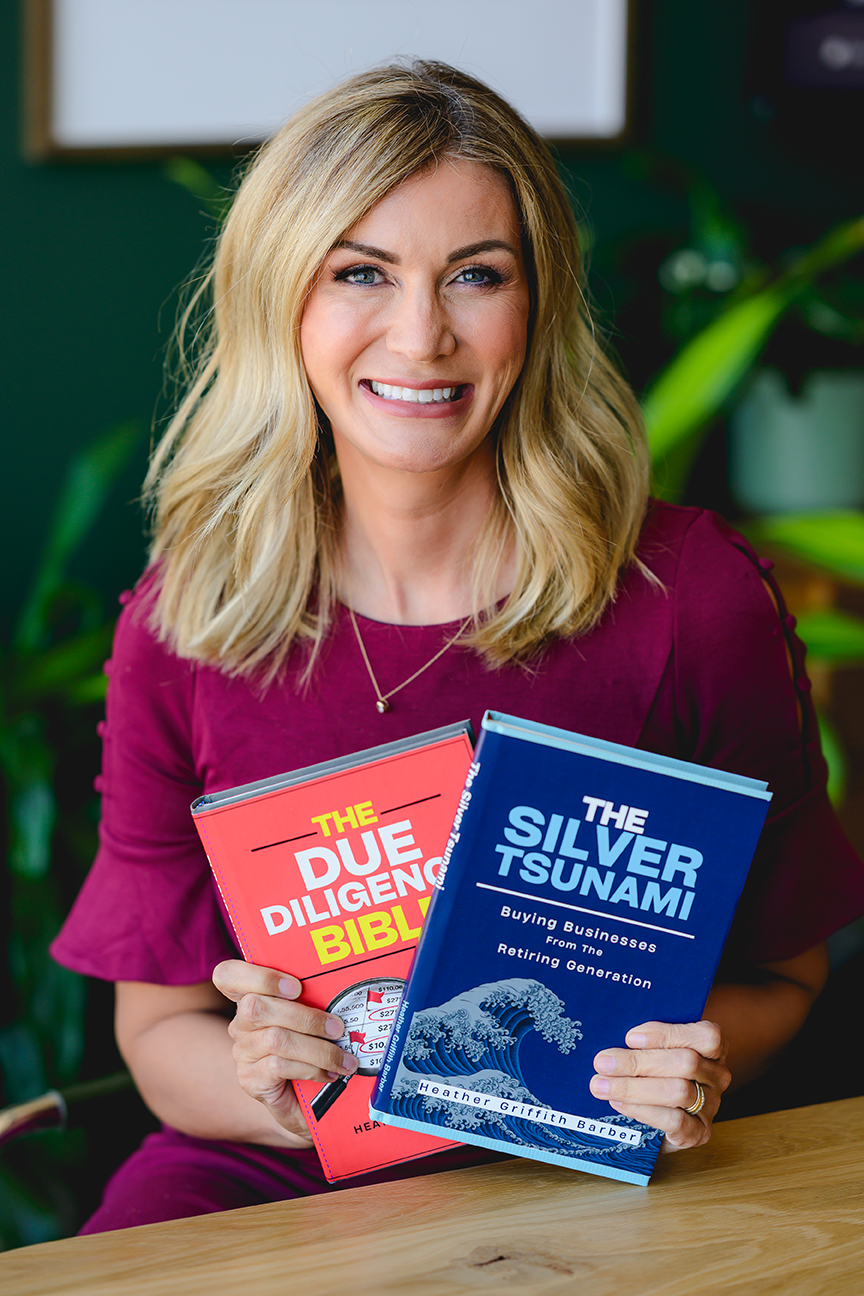 Heather Griffith Barber holding The Silver Tsunami book